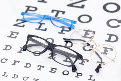 high-angle-two-pairs-glasses-with-letters
